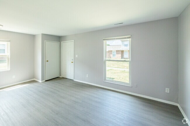 1 habitación, 1 baño - 592 pies cuadrados - Sala de estar - River Pointe Townhomes