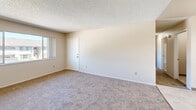 Located at 405 Eastwood Ave in Manteca, California, this single-story, 2-bedroom, 1-bathroom residence offers a practical and well-organized layout. The floor plan connects all living spaces through a central hallway, providing easy access to each room.

The kitchen features dark brown cabinetry with ample upper and lower storage, light countertops, and white appliances including an electric range and refrigerator. The tile-style flooring and under-cabinet range hood add to the kitchen's functional design.

Both bedrooms are carpeted and filled with natural light from sliding windows that offer views of the surrounding neighborhood. The spacious primary bedroom provides generous room for furnishings, while the second bedroom is well-sized and connects conveniently to the hallway and bathroom. Textured ceilings are consistent throughout the unit.

The full bathroom includes a white tub-shower combination with chrome fixtures and tile surround, complemented by neutral-toned walls and tile flooring.

A dedicated laundry area with washer and dryer hookups and built-in cabinetry adds practical convenience. A closet provides additional storage. The overall aesthetic is clean and neutral, offering a move-in-ready canvas throughout.