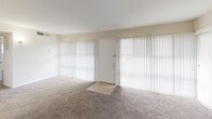 Located at 6604 Belcrest Rd in Hyattsville, MD, this single-floor residence offers a well-organized layout designed for comfortable everyday living. The spacious living area is finished with plush wall-to-wall carpeting and features large windows dressed with vertical blinds, allowing generous natural light to fill the room. A front entry door is flanked by floor-to-ceiling window panels, creating a bright and welcoming atmosphere.

The kitchen is thoughtfully appointed with warm honey-toned wood cabinetry, granite-style countertops, a decorative tile backsplash, and tile flooring. Ample upper and lower cabinet storage provides excellent functionality, and the space accommodates a full-size refrigerator.

The bedrooms continue the carpeted flooring theme and are generously sized, with multiple windows offering natural light and outdoor views. At least one bedroom includes a walk-in closet, providing substantial storage space.

The full bathroom features a tiled tub and shower combination, a vanity with mirror, and overhead ventilation, presenting a clean and efficient design.

Throughout the unit, neutral wall tones and consistent finishes create a cohesive and move-in-ready aesthetic, making this a practical and comfortable home in the Hyattsville area.