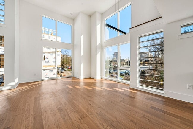 Building Photo - First month FREE! Spacious new downtown to...
