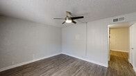 Located at 1737 W Missouri Ave in Phoenix, AZ, this two-story home offers 3 bedrooms and 2 bathrooms across two equally sized floors. The main level features a family room with wood-style laminate flooring, a ceiling fan, and a window that brings in natural light. A staircase connects the levels, and the layout flows into a combined kitchen and dining area. The kitchen is equipped with white cabinetry, light stone countertops, a gas range, dishwasher, refrigerator, double-basin sink, and a pantry for additional storage. The upper level houses the bedrooms, which include a mix of carpet and hard-surface flooring. Each bedroom features windows for natural light and ceiling fans for comfort. The primary bedroom offers a private, well-proportioned layout. Both bathrooms are finished with white vanities, stone-look countertops, and full tub/shower combinations with wood-style flooring. Throughout the home, textured ceilings are a consistent architectural detail. Ample closet space is distributed across both floors, with eight closets total. A patio provides outdoor access, rounding out this functional and straightforward home in central Phoenix.