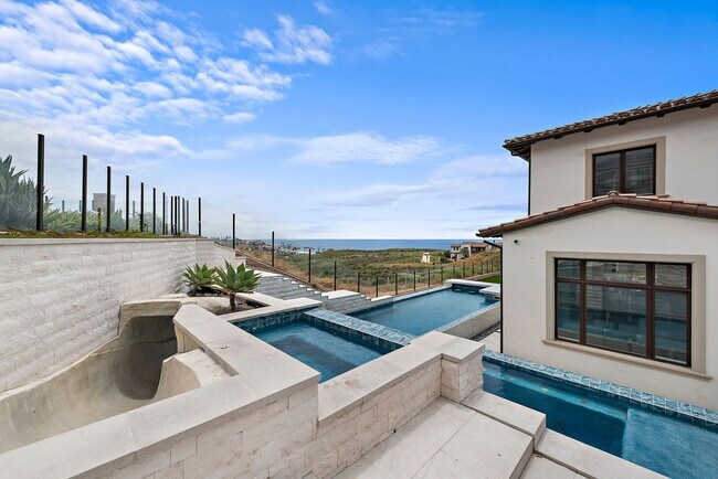 Building Photo - Exquisite coastal estate showcasing stunni...