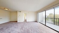 This 500 square foot apartment in Winter Park, Florida, offers a thoughtful layout maximizing space efficiency. The single-story unit features a generously sized 200 square foot bedroom, providing ample space for rest and relaxation. The bedroom is equipped with a ceiling fan, large window for natural light, and closet space with louvered doors.

The kitchen, though compact, boasts modern amenities including stainless steel appliances, a built-in microwave, and ample cabinet space. A stylish tile backsplash adds visual interest, while the light-colored countertops and cabinets create a bright, airy feel. The kitchen floor appears to be a durable, wood-look material, practical for high-traffic areas.

The living area, while not explicitly mentioned, is evident from the images. It features wall-to-wall carpeting for comfort and a seamless transition to the bedroom. The space is brightened by natural light from windows and enhanced by recessed lighting.

Throughout the apartment, neutral tones dominate, creating a blank canvas for personal style. The unit also includes practical features such as a ceiling fan in the main living area and what appears to be central heating and cooling. This apartment offers a well-designed living solution for those seeking a low-maintenance, efficient home in the heart of Winter Park.