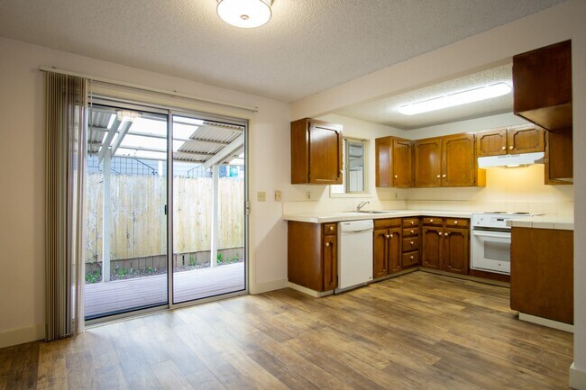 Building Photo - VERY Spacious Corner Townhouse with Private Patio, DW, W/D Hookups!