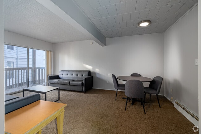 2BR, 1BA - 1,004SF - Living Room and Dining Room - University Plaza