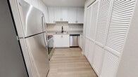 Located at 7529 Windbridge Dr in Sacramento, CA, this one-bedroom, one-bathroom unit offers a thoughtfully designed single-level layout with a clean, contemporary aesthetic throughout. The kitchen is a standout feature, showcasing crisp white cabinetry extending to the ceiling for generous storage, light wood-tone flooring, stainless steel appliances including a refrigerator and dishwasher, and a sleek black-fixture sink — all combining to create a functional and stylish cooking space. A louvered closet door adds a classic touch to the kitchen area. The living space flows seamlessly from the kitchen, continuing the light wood flooring for a cohesive look. The bedroom is generously proportioned, finished with plush neutral carpeting, warm beige walls, and a large window fitted with blinds that allows for ample natural light. A sliding closet provides practical storage, while a ceiling vent ensures year-round comfort. The bathroom is finished with modern black hardware accents, a white vanity with under-cabinet storage, a lighted mirror, and light wood-tone flooring, delivering a clean and polished look. Neutral tones and consistent finishes throughout give the space a fresh, move-in-ready feel.
