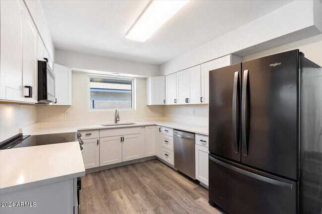 Building Photo - 9945 W Camden Ave