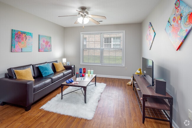 4BR, 2BA - Model - 1,200SF - Living Room - Eagle Village - Historical Access