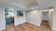 Located at 940 Santa Rosa Blvd, Unit 2323 is a well-appointed single-floor residence designed for comfortable living. The open-concept layout seamlessly connects the living and dining areas, both finished with light-toned luxury vinyl plank flooring that adds a clean, modern aesthetic throughout. Ceiling fans are featured in the main living spaces, promoting airflow and comfort. Sliding glass doors in the living room invite abundant natural light and provide access to an outdoor area with views of the surrounding landscape.

The kitchen is thoughtfully designed with gray raised-panel cabinetry, granite-style countertops, and a full suite of stainless steel appliances, including a refrigerator, microwave, and dishwasher. A pass-through window connects the kitchen to the adjacent dining area, enhancing the open feel of the space.

The bedrooms are carpeted for warmth and comfort, each offering natural light through windows with views of mature greenery outside. Ceiling fans are present in the bedrooms as well. A generously sized walk-in closet with wire shelving systems provides ample storage. Neutral wall tones and textured ceilings are consistent throughout, creating a cohesive and inviting atmosphere across the entire residence.