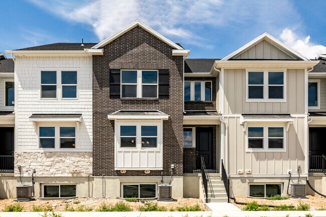 Exterior (Middle Townhome-brick and black door) - 12981 S Oberon Ln Townhome