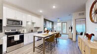 Located at 1421 Rural Hill Rd in Nashville, TN, this thoughtfully designed one-bedroom, one-bathroom unit offers a modern and cohesive living experience across a single floor. Light wood-look flooring flows throughout, creating a seamless and airy aesthetic.

The open-concept kitchen is a standout feature, showcasing white shaker cabinetry, granite countertops, a subway tile backsplash, and stainless steel appliances. A central island with bar seating provides additional prep space and casual dining, connecting effortlessly to the adjacent living area.

The living room is accented by a bold olive green feature wall, a ceiling fan, and a glass-panel door that invites natural light and outdoor views. The space is comfortable and versatile, ideal for both relaxing and entertaining.

The bedroom features a warm terracotta accent wall, light-filled windows with sheer curtains, and durable wood-look flooring, creating a cozy yet modern retreat. The bathroom maintains the same clean aesthetic with white cabinetry, granite countertops, and a marble-tiled shower surround.

A dedicated laundry room with a full-size washer and dryer adds everyday convenience, while a hallway, closet, and thoughtful layout maximize the functionality of the space throughout.