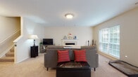 Located at 6345 Cooper Rd in Columbus, Ohio, this single-floor home offers a comfortable and functional layout with well-defined living spaces. The living room serves as the heart of the home, centered around a classic white-mantled fireplace that adds warmth and character to the room. Soft carpeting, neutral walls, and a large window that invites natural light create a welcoming atmosphere. The space comfortably accommodates a full seating arrangement, entertainment setup, and additional decor, reflecting a versatile and livable design.

A separate bonus room provides additional flexibility, featuring the same neutral color palette and plush carpeting. This space includes a closet and connects to a stairwell area, making it suitable for use as a home office, guest room, or recreation space. The room benefits from HVAC venting and ample wall space.

A dedicated fitness room rounds out the home's offerings, bathed in natural light from a sliding glass door with vertical blinds. The carpeted floor and open layout make it well-suited as a workout space or flexible bonus area. Together, these rooms reflect a thoughtfully designed home that balances comfort, utility, and adaptability throughout its single level.