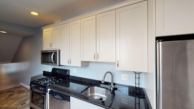 Building Photo - Room in 4 Bedroom Home at 24 S Washington St