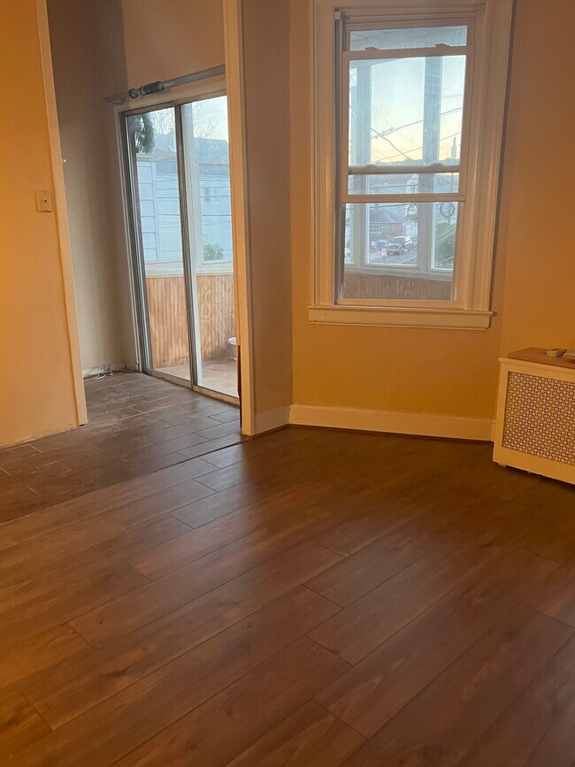Living room and sliding door to enclosed porch - 96 Richard St