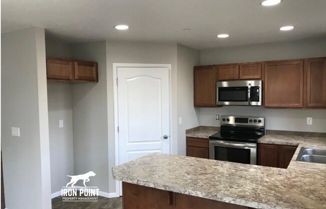 Building Photo - 3bed/2bath - Landscaping Included plus fenced yard, & two car garage.