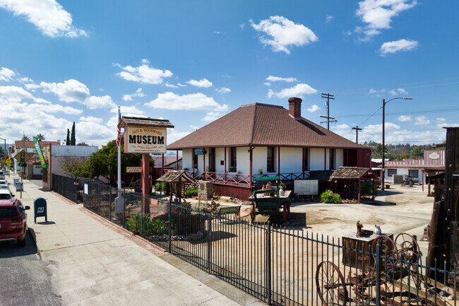 Visit an original house from 1886, blacksmith shops, vintage cars, and carriages at the Guy B. Woodward Museum.
