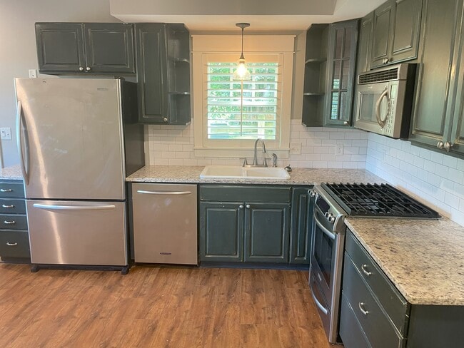 Kitchen: Granite countertops and stainless steel appliances - 460 E Pharr Rd