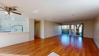 Located at 520 E Murray Canyon Dr in Palm Springs, CA, this single-story 2-bedroom, 2-bathroom home offers a well-designed layout with comfortable living spaces throughout. Warm hardwood flooring flows seamlessly across the main living areas, complementing the neutral palette of the walls and ceilings.

The open-concept living and dining area is bright and spacious, with recessed lighting and large sliding glass doors that invite natural light and provide direct access to one of two outdoor patios, offering views of lush greenery. The kitchen features white cabinetry with modern hardware, a gas range, built-in microwave, and ample counter and storage space, anchored by a peninsula with pendant lighting that opens to the living area — ideal for entertaining.

The generously sized primary bedroom includes a ceiling fan and ample closet space, with an en-suite bathroom featuring a walk-in shower, white vanity, and tile flooring. The second bedroom is well-proportioned, also with a ceiling fan and a built-in closet. The second bathroom includes a full soaking tub and shower combination with a window for natural light. Additional conveniences include an in-unit laundry area, a utility room, and abundant closet storage throughout. A second patio further enhances the indoor-outdoor living experience characteristic of the Palm Springs lifestyle.