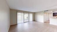 Located at 6500 Maplewood Rd in Mayfield Heights, Ohio, this 2-bedroom, 1-bathroom residence offers a thoughtfully designed single-floor layout with a clean, neutral palette throughout. The open living room is a standout feature, showcasing light wood-style luxury vinyl flooring, warm beige walls, and a large sliding glass door with vertical blinds that floods the space with natural light. The kitchen is well-equipped with dark gray shaker-style cabinetry, marble-patterned countertops, and a full suite of stainless steel appliances including a gas range, dishwasher, and refrigerator — all set atop matching light wood-style flooring. Both bedrooms feature plush wall-to-wall carpeting and ceiling fans, with ample natural light provided by windows dressed with horizontal blinds. The primary bedroom is generously sized and includes a dedicated closet with bifold doors, while the second bedroom offers a comfortable, cozy feel with its own closet access. The bathroom is clean and functional, featuring a full soaking tub with white tile surround. Throughout the residence, neutral tones, practical finishes, and a well-connected layout create a comfortable and move-in-ready living environment.