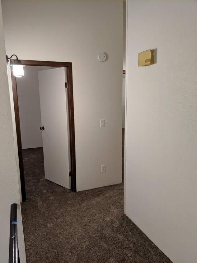 Landing at the top of the stairs looking towards bedroom 2. - 2115 Pleasanton St