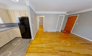 This 610 square foot apartment in Royal Oak, Michigan offers a well-designed living space with two bedrooms and two bathrooms. The interior showcases gleaming hardwood floors throughout, creating a warm and inviting atmosphere. The kitchen is equipped with modern black appliances, light-colored cabinetry, and a practical layout, ideal for meal preparation.

The primary bedroom, measuring 130 square feet, provides ample space and features two windows that allow natural light to flood the room. Both bedrooms boast the same beautiful hardwood flooring and neutral gray walls, offering a blank canvas for personalization.

The bathroom is fitted with contemporary fixtures, including a tiled tub-shower combination with a glass door, providing both functionality and style. A wall-mounted storage unit adds extra convenience.

The living area is open and bright, with large windows that offer views of the surrounding area. The apartment's compact design maximizes the use of space, with a hallway connecting the various rooms efficiently.

Storage solutions are integrated throughout, including closets in both bedrooms and additional cabinet space in the kitchen. The property's single-floor layout enhances accessibility and ease of movement.

Located at 118 N Center St in Royal Oak, this apartment combines modern amenities with a prime location, making it an attractive option for those seeking a comfortable urban living experience.