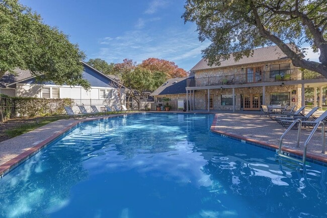 Experience luxury living at Distinction Apartment Homes, where modern design meets serene outdoor spaces. Enjoy the sparkling pool and beautifully landscaped courtyards that create the perfect retreat. Schedule your tour today! - Distinction Apartment Homes