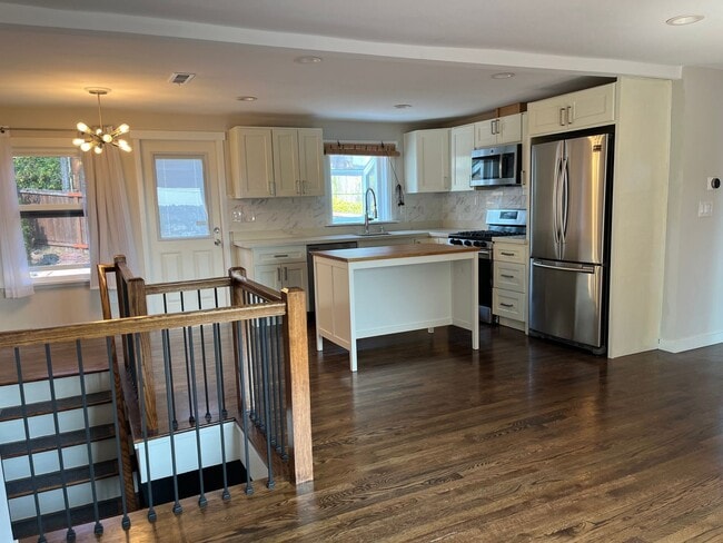 Building Photo - Partial view updated Magnolia home on a qu...