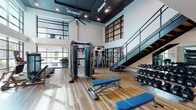 Located in Orlando, Florida, this two-story fitness center at Palma Linda Way is a well-appointed facility designed to support a comprehensive workout experience. The space is defined by its soaring double-height ceilings, dark tray ceiling accents with recessed lighting, and large industrial-style black-framed glass windows and partitions that flood the interior with natural light.

The ground floor serves as the primary workout area, featuring warm-toned hardwood flooring throughout. It is equipped with a cable machine, adjustable weight benches, and a full rack of dumbbells positioned alongside floor-to-ceiling mirrors. A row of elliptical machines and cardio equipment lines the wall, each outfitted with individual display screens. A dedicated treadmill area features expansive glass garage-style doors that open toward a landscaped outdoor pool area, offering refreshing views of palm trees and the surrounding grounds.

A sleek metal staircase with cable railings connects the ground floor to the upper level, which houses additional cardio equipment including rowing machines and stationary bikes, also accompanied by mounted televisions. Oversized black-framed clerestory windows on the upper level further enhance the bright, airy atmosphere. Strategically placed ceiling fans ensure comfortable airflow throughout both floors, making this fitness center a thoroughly functional and visually striking space.