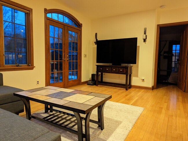 65" TV in the living room - 4130 Meyer Ave