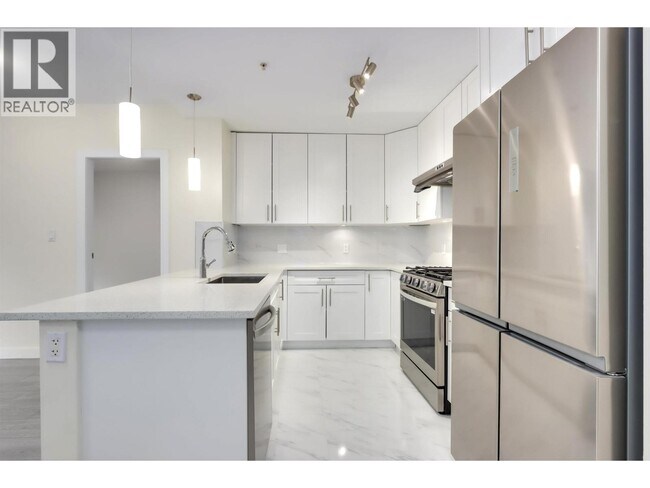 Photo du bâtiment - 6888 Alderbridge Wy