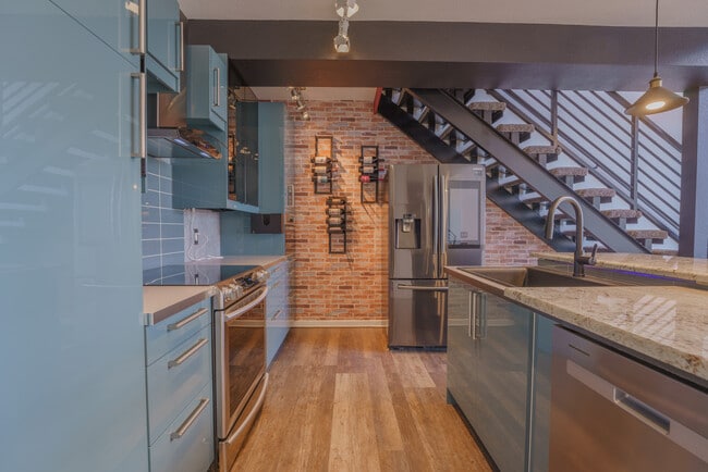 Kitchen including stainless steel appliances - 7240 W Custer Ave (Lakewood, CO) Apartment