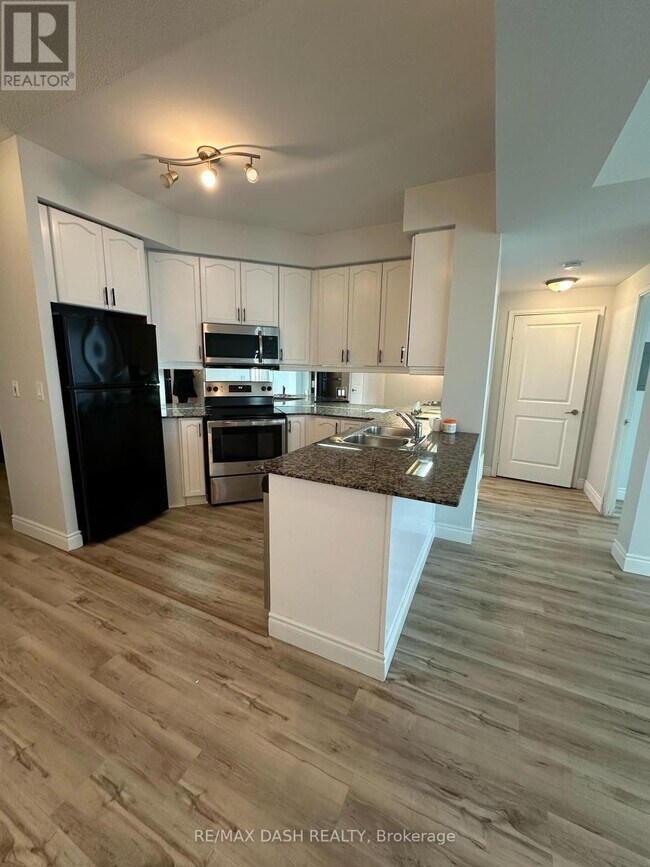 Photo du bâtiment - 80 Absolute Ave