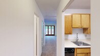 Located on the fourth floor at 25 Broad Street Ext in Groton, Connecticut, this one-bedroom, one-bathroom unit offers a practical and efficient layout across a single floor. The generously sized bedroom features neutral carpeting, crisp white walls with a classic chair-rail detail, and a ceiling fan with light fixture, creating a comfortable and well-lit retreat. A dedicated closet provides convenient storage.

The galley-style kitchen is equipped with warm wood cabinetry offering ample upper and lower storage, light-toned countertops, a stainless steel sink, and black appliances including a range and refrigerator. The tile flooring adds durability and ease of maintenance to this functional cooking space.

The bathroom features classic ceramic tile surrounding a full soaking tub with an overhead shower, complemented by a wood-toned vanity with a countertop sink. The timeless tile detailing extends along the lower walls, giving the bathroom a clean, cohesive look.

Throughout the unit, baseboard heating ensures year-round comfort, and the neutral color palette across all rooms creates a bright, move-in-ready atmosphere. This compact yet well-appointed unit offers a straightforward, comfortable living experience in Groton, CT.