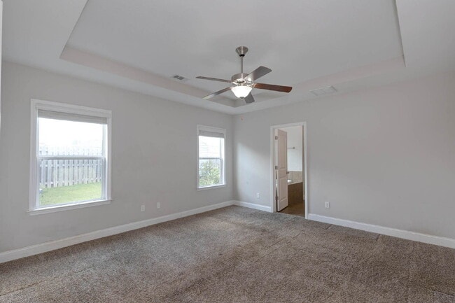 Building Photo - 4BR/3.5BA · 2,809 SF · Owner's Suite on Main · Fenced Yard · Midland, GA — $2,800/mo