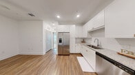 Located at 7785 Griffon Ln in Vero Beach, Florida, this efficiently designed single-floor, 2-bedroom, 1-bathroom home offers a clean, bright, and functional layout. The kitchen is a standout feature, finished with crisp white shaker cabinetry, granite-look countertops, a subway tile backsplash, and a full suite of stainless steel appliances including a side-by-side refrigerator with ice maker, electric range, microwave, and dishwasher. Warm wood-look luxury vinyl flooring runs throughout the kitchen and main living areas, lending a cohesive and contemporary feel. The primary bedroom is a comfortable, well-proportioned space with plush neutral carpeting, a barn-style sliding door, and access to a dedicated walk-in closet with built-in wire shelving. A second carpeted bedroom features a window with blinds that invites natural light. The full bathroom is finished in clean white tones, featuring a soaking tub and shower combination with classic subway tile surround and chrome fixtures. Throughout the home, white walls and recessed lighting create a bright, airy ambiance. The thoughtful layout maximizes every inch of the space, making it an ideal, low-maintenance residence in the heart of Vero Beach.