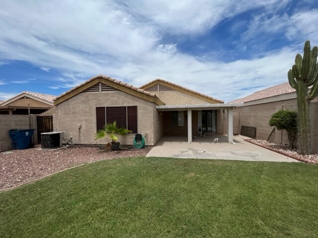 Green back yard with grass. - 1169 W 18th Ave