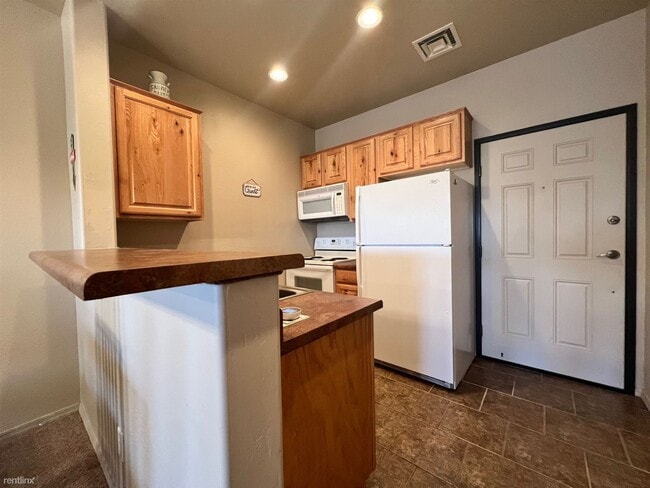 Building Photo - 2 br, 1 bath Condo - 2403 Quarter Horse Tr...