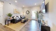 Located at 723 W 19th St in Panama City, Florida, this well-appointed single-story home offers 3 bedrooms and 2 bathrooms within a thoughtfully designed floor plan. Wood-look flooring flows consistently throughout, tying each room together with a warm, cohesive aesthetic.

The living room greets you with crown molding, recessed lighting, and a front entry door framed by a window that draws in natural light. The open-concept kitchen is a standout feature, anchored by a striking blue shiplap island with bar seating, white shaker cabinetry with matte black hardware, a bold navy tile backsplash, and stainless steel appliances. A dining area sits adjacent, completing the functional entertaining space.

The primary bedroom is generously proportioned, featuring multiple windows with natural light, a walk-in closet, and a calm, neutral palette. The additional bedrooms offer comfortable dimensions with ample natural light. Both bathrooms are finished with white shaker vanities, matte black fixtures, and clean, modern detailing.

A hallway bathroom includes a tub-shower combination and a large mirror above the vanity. Throughout the home, the design maintains a cohesive coastal-modern character, with neutral wall tones and warm wood flooring creating an inviting, move-in-ready atmosphere.