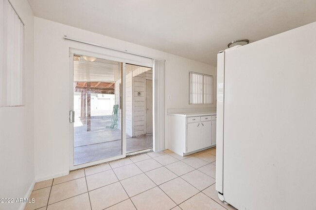 View from Den to kitchen to parking - 6212 N 12th Pl