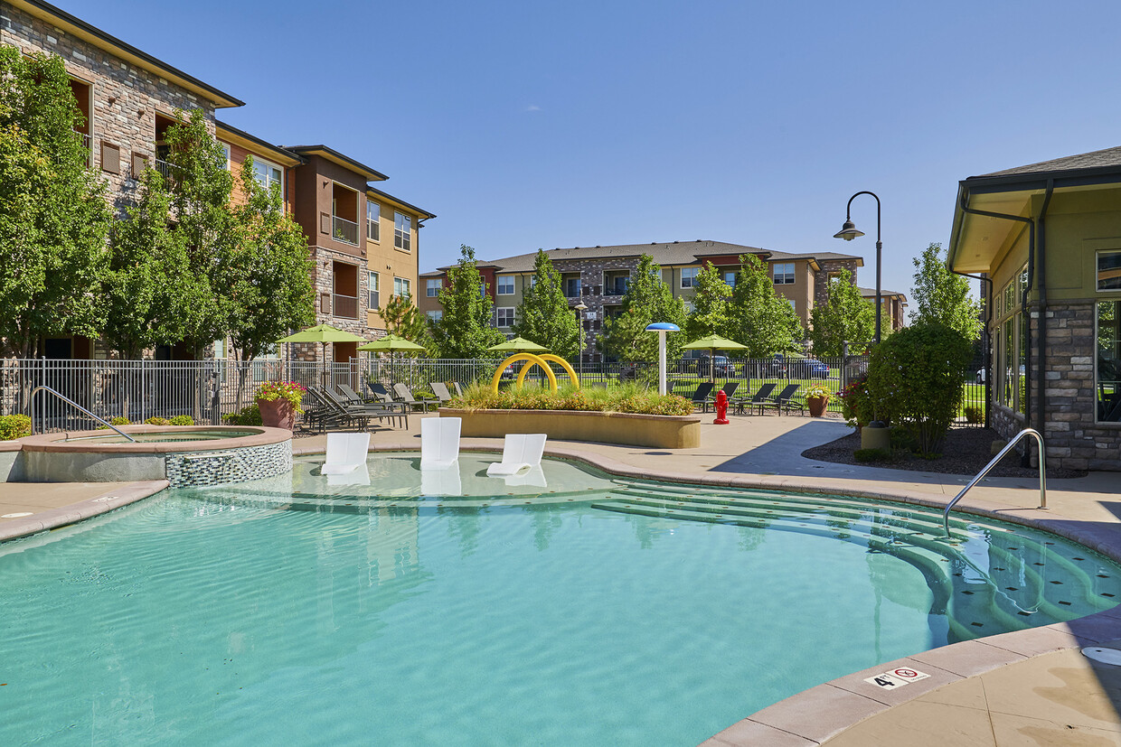 Resort-inspired pool with tanning shelf - Acadia at Cornerstar Apartments