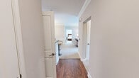 Located at 10905 Hawkes Bay Way in Knoxville, TN, this well-appointed single-story, 2-bedroom, 2-bathroom home offers a thoughtfully designed layout across a comfortable footprint. The interior is finished with a consistent warm, neutral palette, crown molding, and a mix of hardwood-style flooring and plush carpeting throughout.

The living room is a standout feature, anchored by a set of French doors with transom windows above that invite generous natural light and provide outdoor views. The adjacent dining room showcases wainscoting, crown molding, and an elegant chandelier, creating a refined atmosphere for entertaining. The kitchen connects seamlessly to the main living areas and includes stainless steel appliances and access to a pantry closet, with a convenient passthrough to the dedicated laundry room housing a full-size washer and dryer.

The spacious primary bedroom features crown molding, a ceiling fan, and large windows overlooking the outdoors, accompanied by a closet and private bathroom with a glass-enclosed walk-in shower. The second bedroom is equally well-appointed with a ceiling fan and closet access. A dedicated office with a built-in desk and natural light adds versatile functionality. Two closets and an interior hallway complete the efficient and comfortable floor plan.