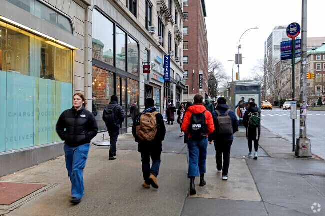 Residents of the Morningside Heights community shopping and visiting local shops.