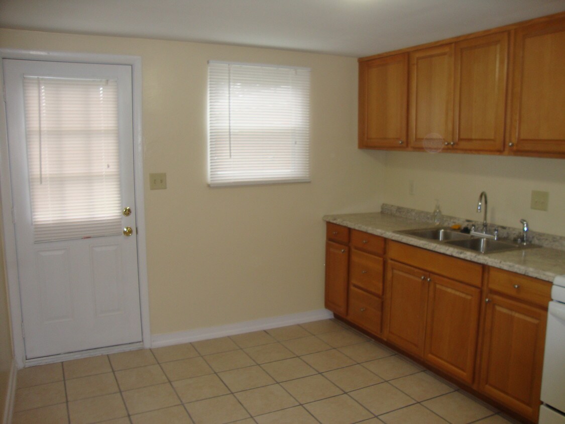 Kitchen showing back door out to the patio. - 2089 Revere Dr