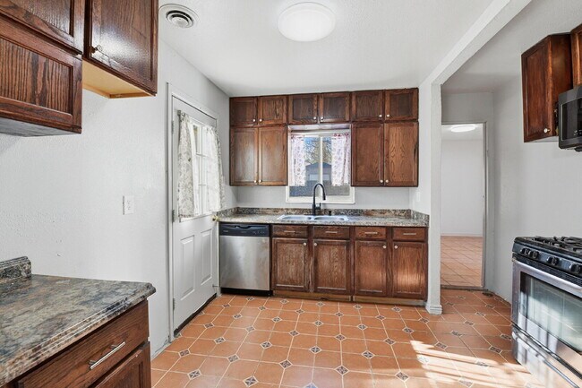 Building Photo - $1,930.95 - 3 Bedrooms, 1 Bathroom, Single Family Home in Aurora with fenced Yard!