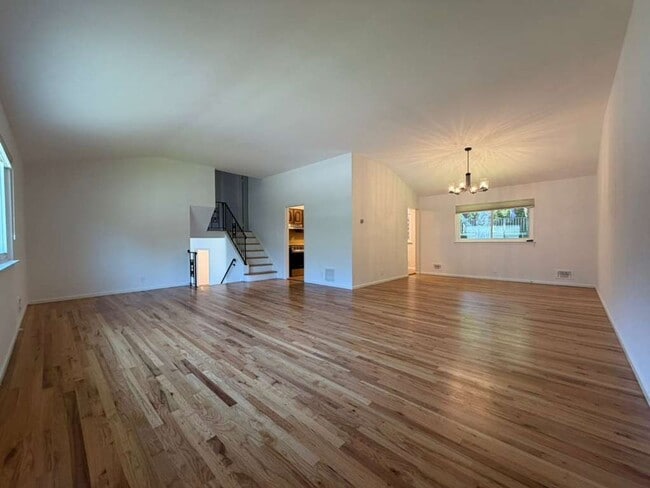 Photo - Spacious 4-Bedroom Home with Functional Layout, Backyard Access & Attached Garage