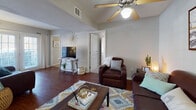Located at 3305 10th St in Greenville, NC, this single-floor residence offers a thoughtfully laid-out floor plan with multiple bedrooms, bathrooms, and comfortable communal spaces. The living room serves as the heart of the home, featuring rich hardwood flooring, a ceiling fan, and ample room for seating arrangements. The space flows naturally toward a dining area, making it well-suited for both relaxing and entertaining.

The kitchen is equipped with white shaker-style cabinetry, granite countertops, a stainless steel refrigerator, and a black electric range with a ventilation hood overhead — a functional and clean workspace for everyday cooking.

Each bedroom is carpeted for comfort and includes a ceiling fan. The bedrooms feature windows that allow natural light to filter in, along with sufficient space for a bed, dresser, and desk. The rooms offer a cozy, private atmosphere suitable for rest or study.

The bathrooms are consistently finished with white vanity cabinetry accented by gold hardware, white sink basins, framed mirrors, and shower/tub combinations enclosed by decorative curtains. Tile flooring runs throughout each bathroom, lending a clean and polished look. The overall aesthetic of the home is neutral and well-maintained, providing a welcoming and livable environment.