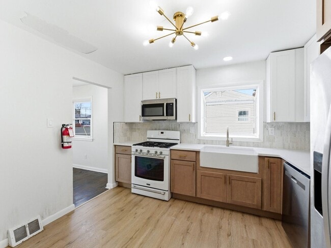 Photo - Charming Renovated 4-Bedroom Rental with Spacious Backyard & Bonus Basement Space in Somerdale House