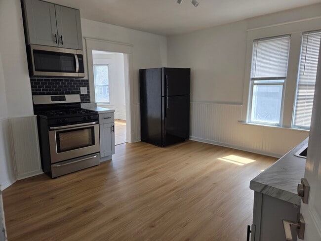 Kitchen with Stove and Microwave - 5706 22nd Ave