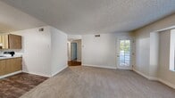Located at 132 Fountain Oaks Cir in Sacramento, CA, this single-story, 3-bedroom, 1-bathroom home offers a practical and well-organized layout. The living room features neutral-toned carpet, textured ceilings, and a glass-paneled exterior door that brings in natural light and provides direct outdoor access. A second exterior door and large windows throughout the home frame views of surrounding greenery, keeping the interior bright and connected to the outdoors.

The kitchen is equipped with light wood cabinetry offering ample storage, a double-basin sink, a dishwasher, an electric range, and a full-size refrigerator. Wood-look vinyl flooring grounds the space with a clean, durable finish.

The three bedrooms are carpeted and finished with neutral walls and textured ceilings. Each room features windows that allow natural light and outdoor views, including tree canopy and neighborhood scenery. The primary bedroom provides a comfortable, well-proportioned retreat.

A hallway connects the bedrooms to the single full bathroom, which includes a combination tub and shower with clean white surround and chrome fixtures. The home's straightforward single-floor design ensures easy navigation throughout, making it a functional and accessible living space.