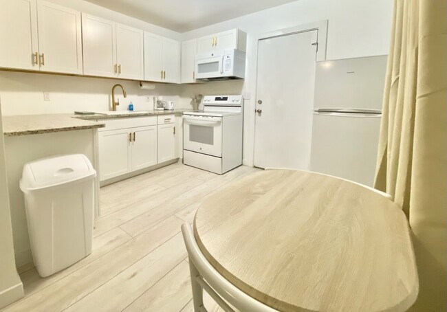 Kitchen with dishes and utensils - 4208 Kelson Ave